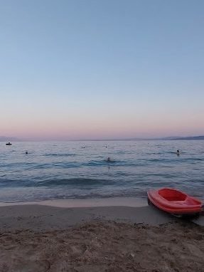 The sunset with its purple colors on the horizon over Gialtra beach
