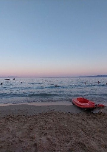 The sunset with its purple colors on the horizon over Gialtra beach
